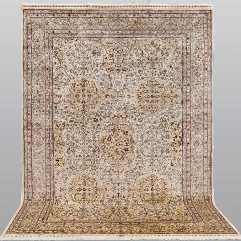 An oriental silk carpet, c. 279 x 184 cm.