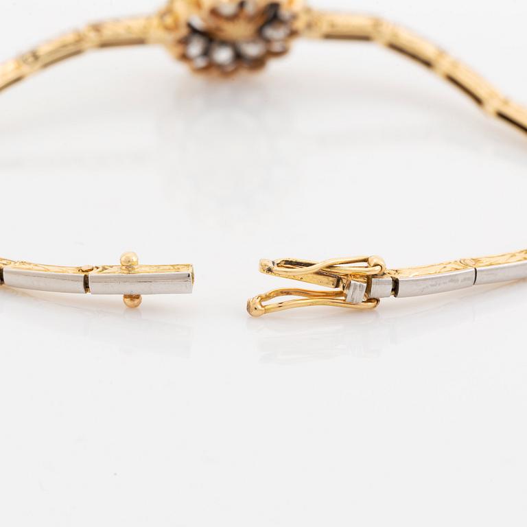 A gold and platinum bracelet with a bouton pearl and set with old- and eight-cut diamonds.