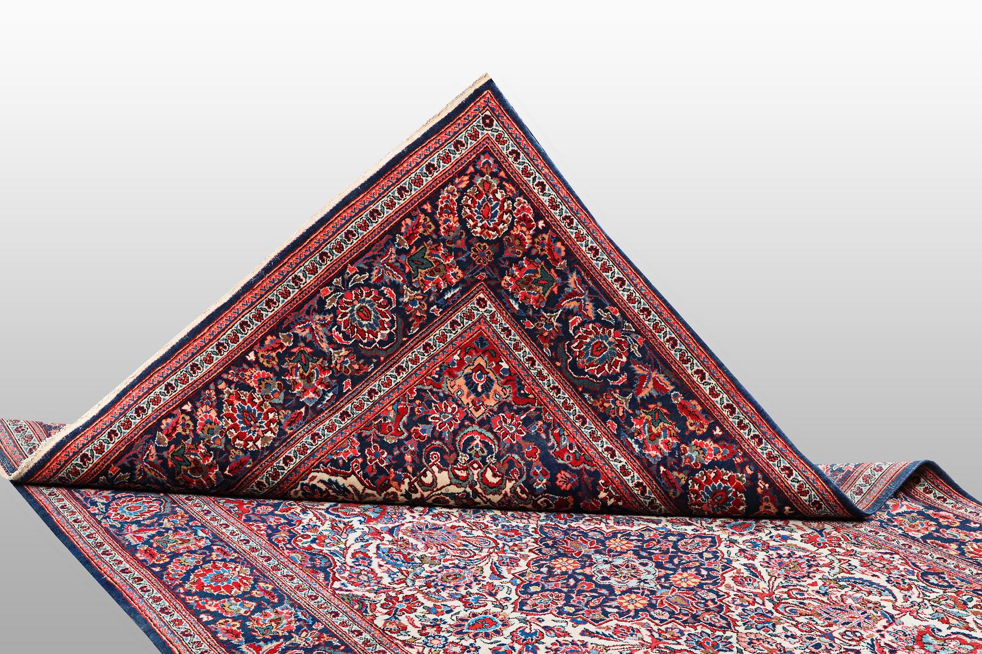 A rug, semi-antique Keshan, 217 x 134 cm.
