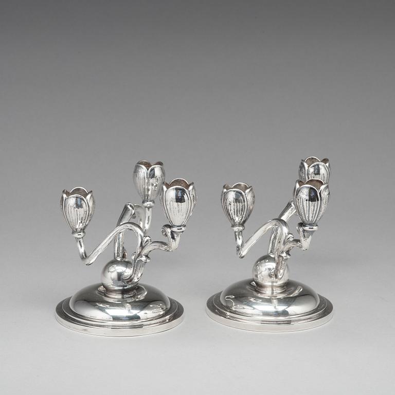 A pair of W.A. Bolin silver candelabra for three lights, Stockholm 1955.