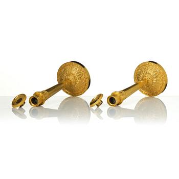 A pair of Empire ormolu candlesticks.