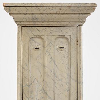 A Swedish column-shaped cabinet 19 th century.