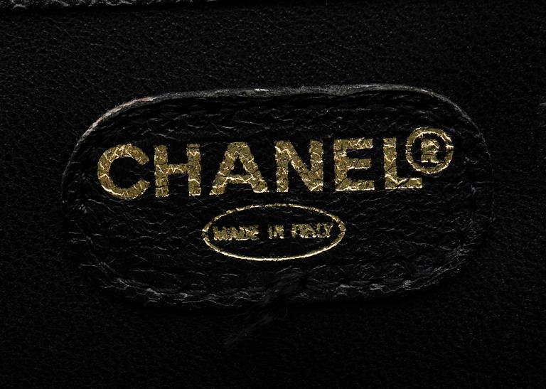 A 21th cent black "caviar" leather beautybox/weekendbag by Chanel.