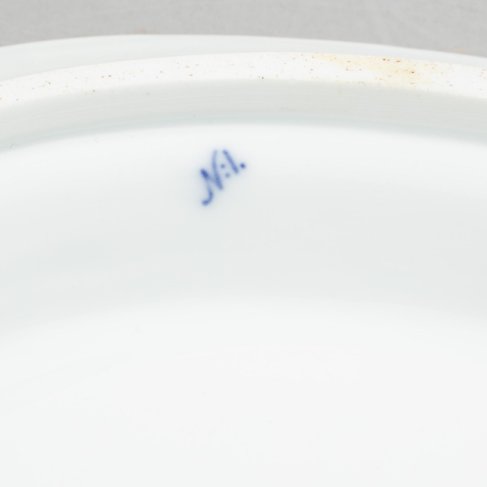 A porcelain 'Blue fluted half lace' / 'Musselmalet' tureen with cover and stand, Royal Copenhagen, 19th century.