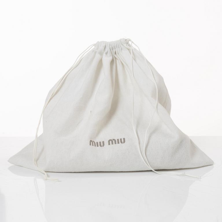 Miu Miu, a handbag.