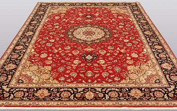 A carpet, Täbriz part silk, 341 x 248 cm.