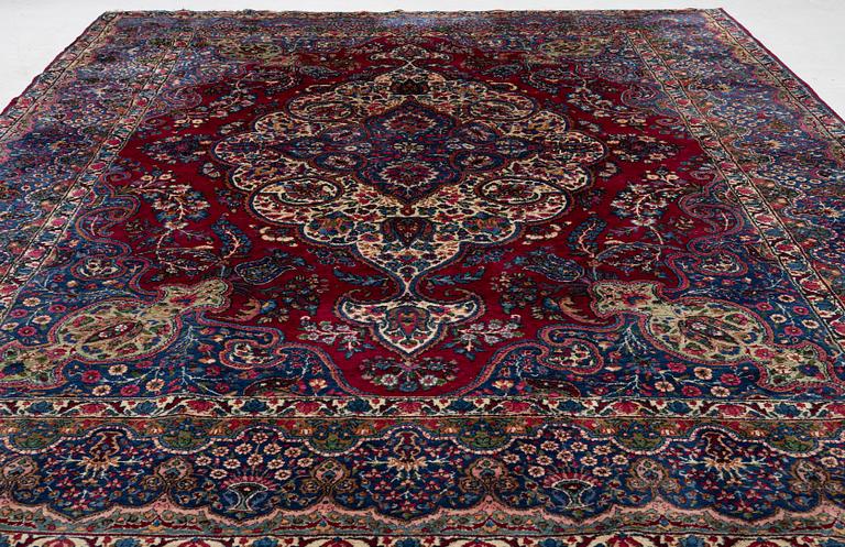A Kerman carpet, c. 365 x 265 cm.