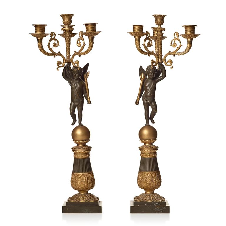 A pair of French Empire early 19th century four-light candelabra.