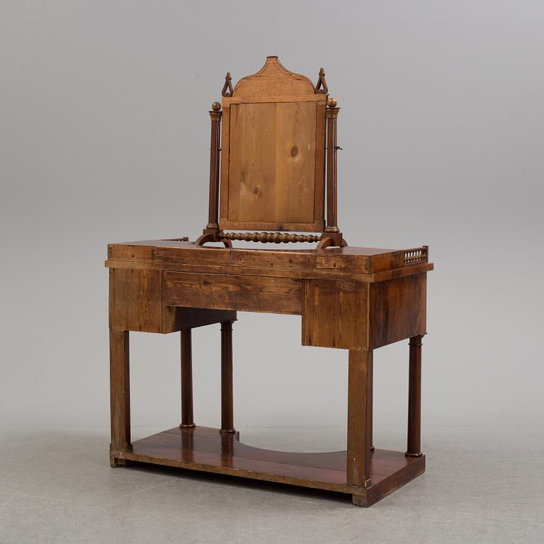 A  mahogany empire dressing 19th century table with mirror.