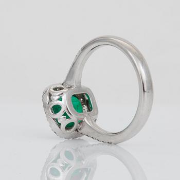 An emerald, circa 2 cts, and brilliant-cut diamond ring.