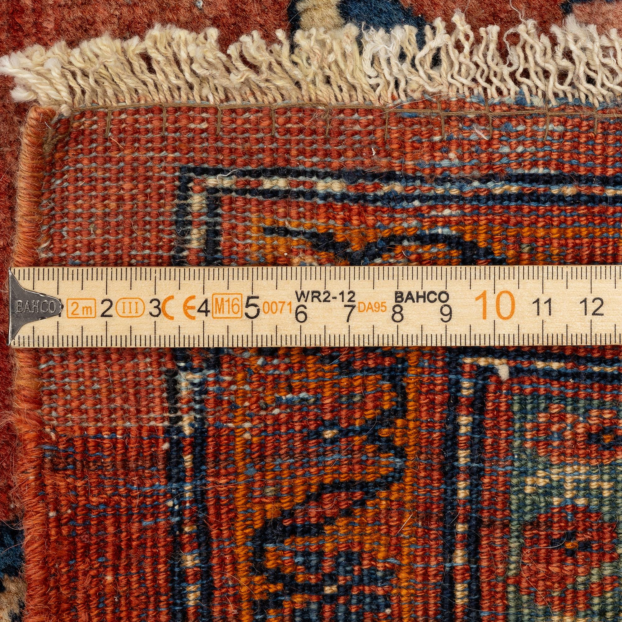 An Antique Sarouk carpet, West Persia, c. 353 x 260 cm.
