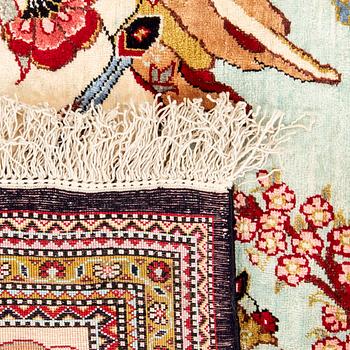 Oriental figural silk rug, approximately 57x79 cm.
