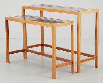 A Josef Frank set of mahogany and stainless steel tables by Svenskt Tenn.