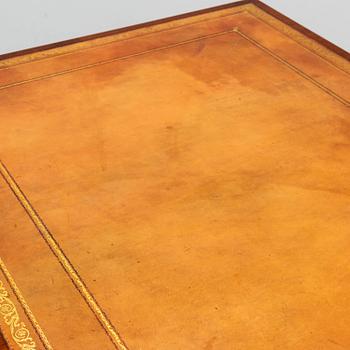 A contemporary mahogany and leather partners desk in the George III style.