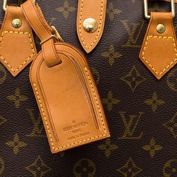 LOUIS VUITTON, a 'Housse Porte-Habits' garment bag.