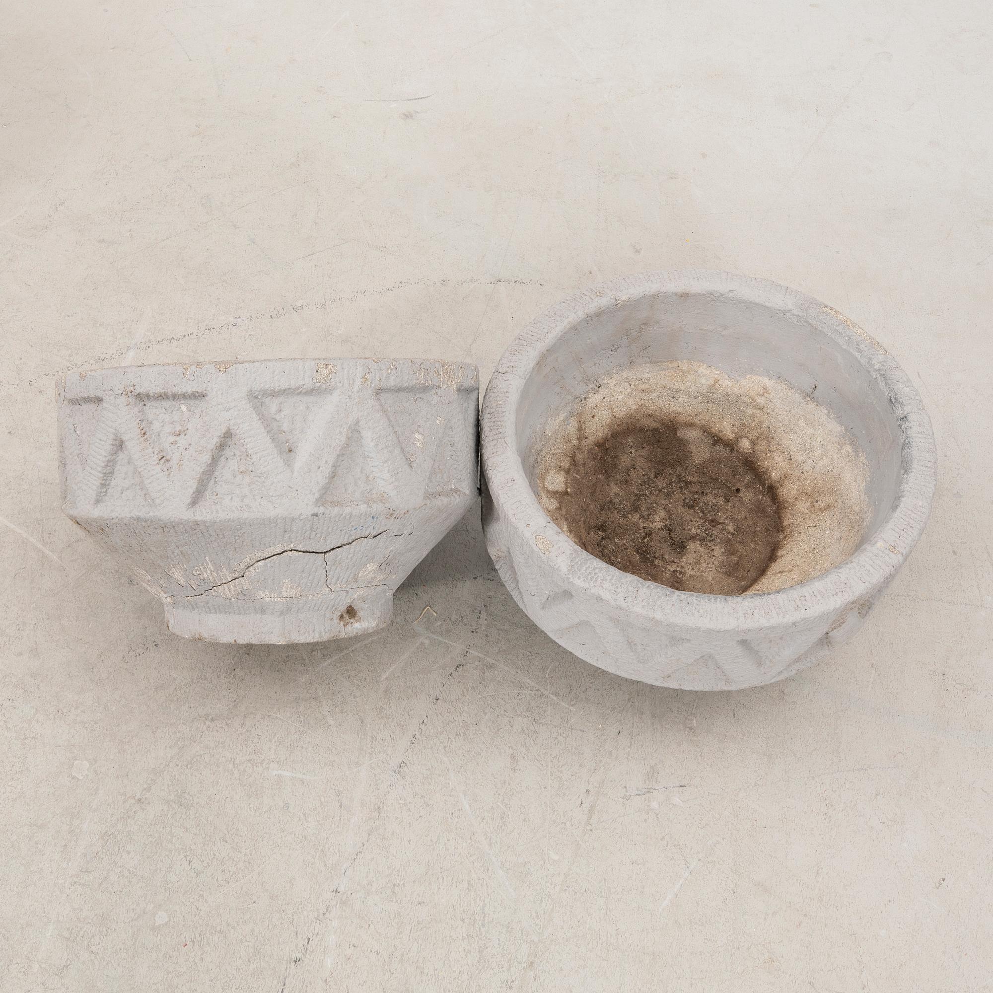 A pair of concrete garden urns later part of the 20th century.