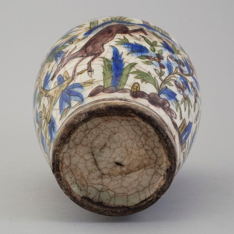 A POTTERY URN, probably late Qajar dynasty, Persia/Iran, height ca 27,5 cm.