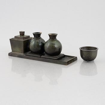 Guldsmedsaktiebolaget, a writing stand and a pair of candle holders, bronze, Sweden, 1920's.