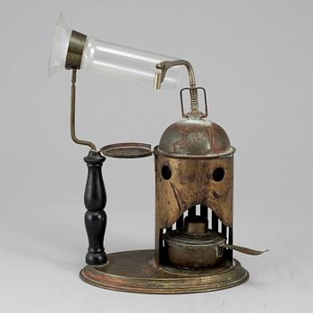 A tinplate burner, 20th century.