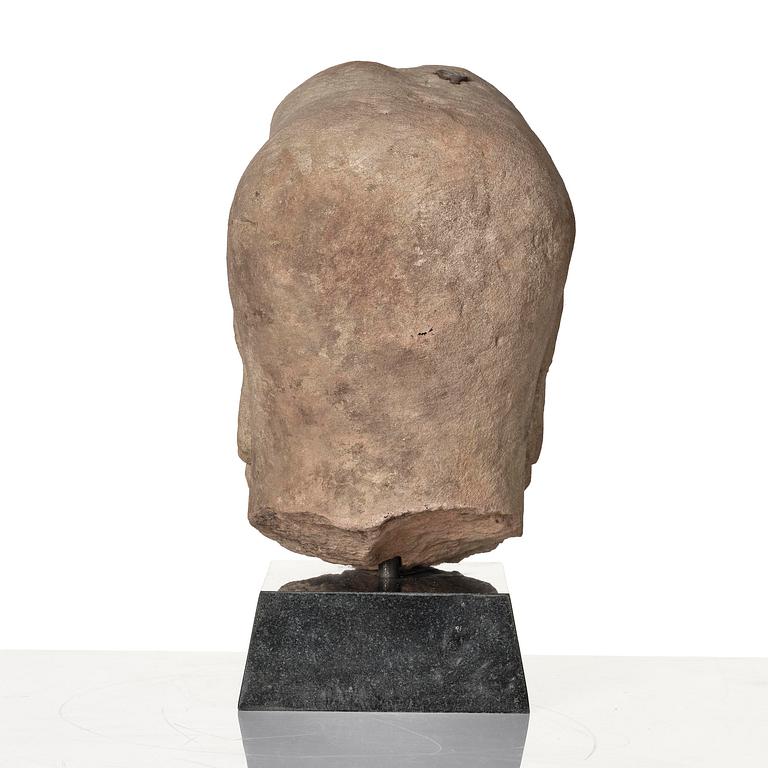 A sanstone sculpture of a Luohan, Yuanstyle.