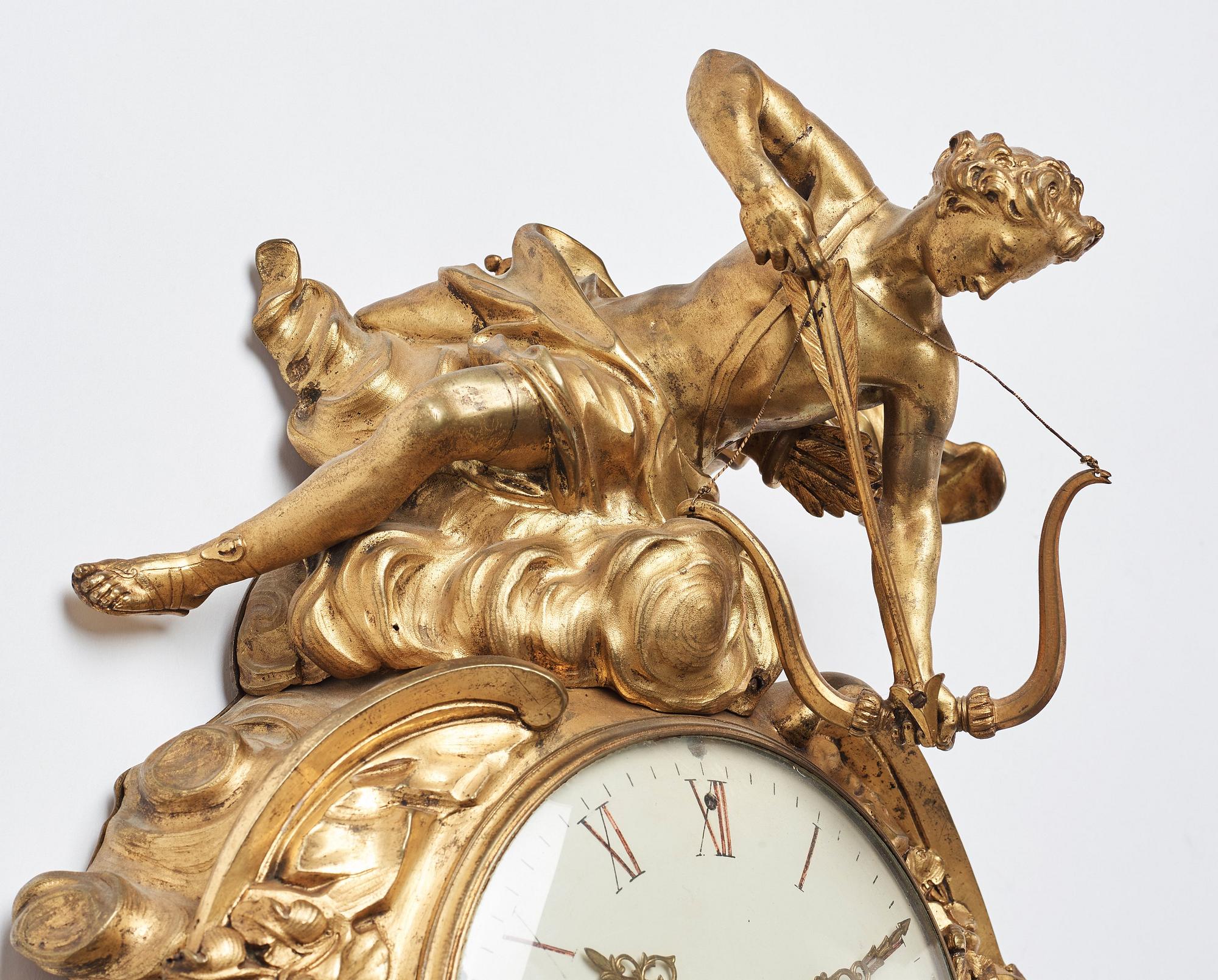 A Louis XV mid 18th century gilt bronze wall clock marked "Caffieri fecit".