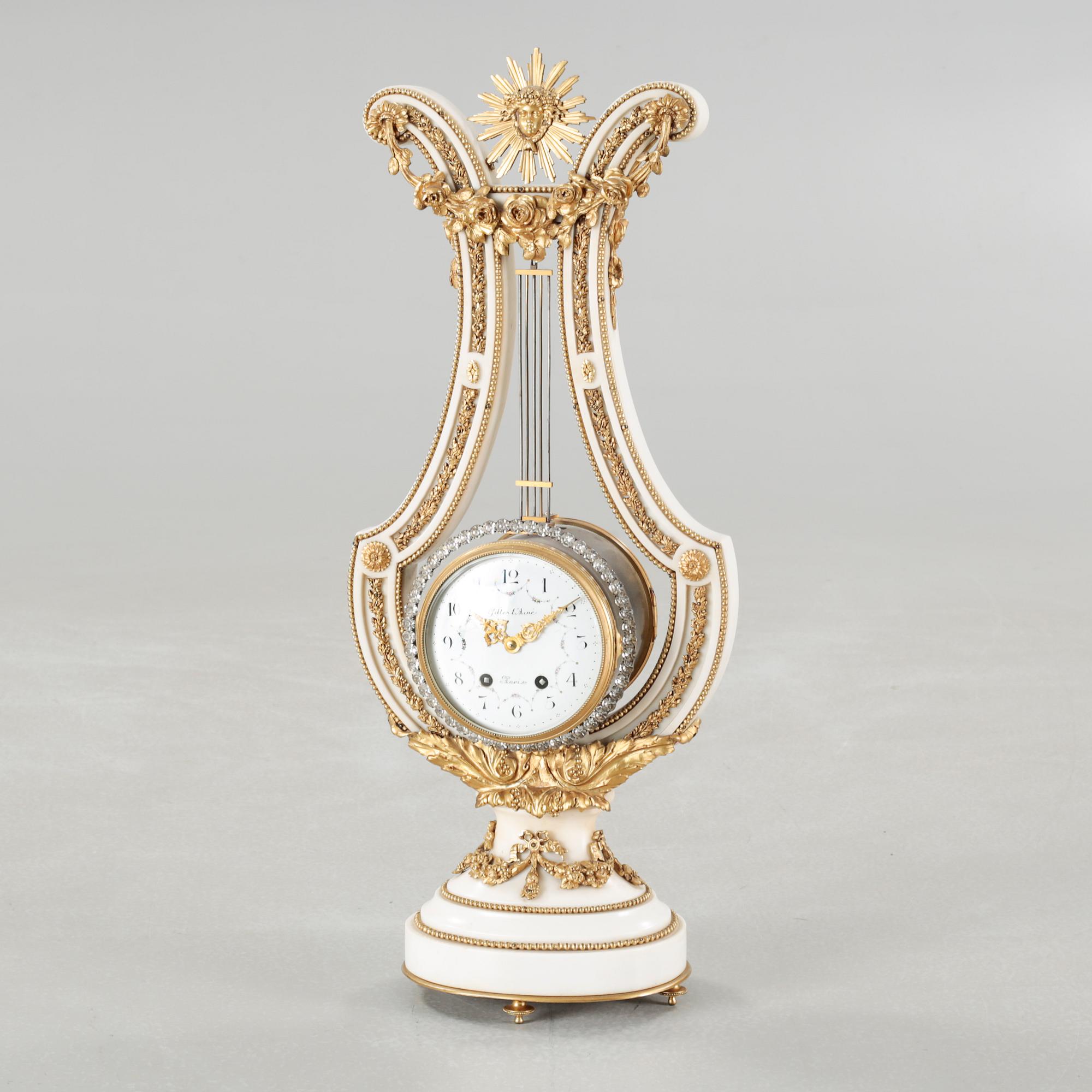 A table clock, dial marked "Gilles l'Ainé Paris", made around year 1900.