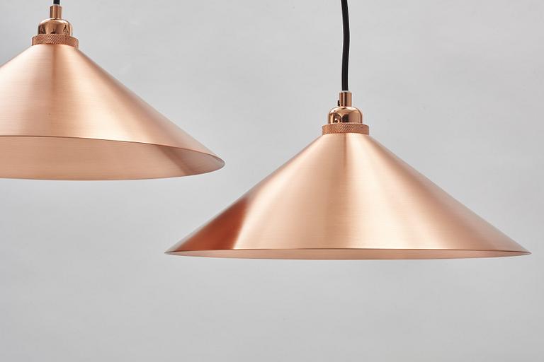 A pair of Frama Shade 360 ceiling lamps.
