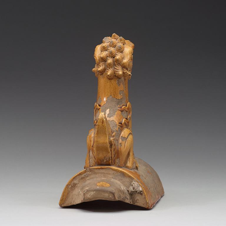 A yellow glazed roof tile figure of a Buddhist lion, Ming dynasty (1368-1644).