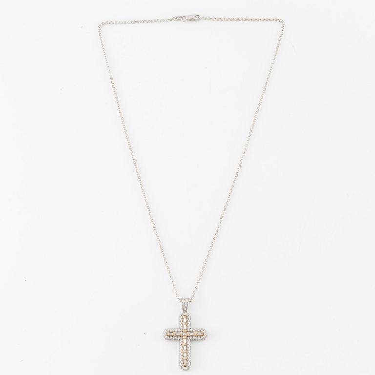 Necklace, 18K white gold in the form of a cross, set with baguette and brilliant-cut diamonds.