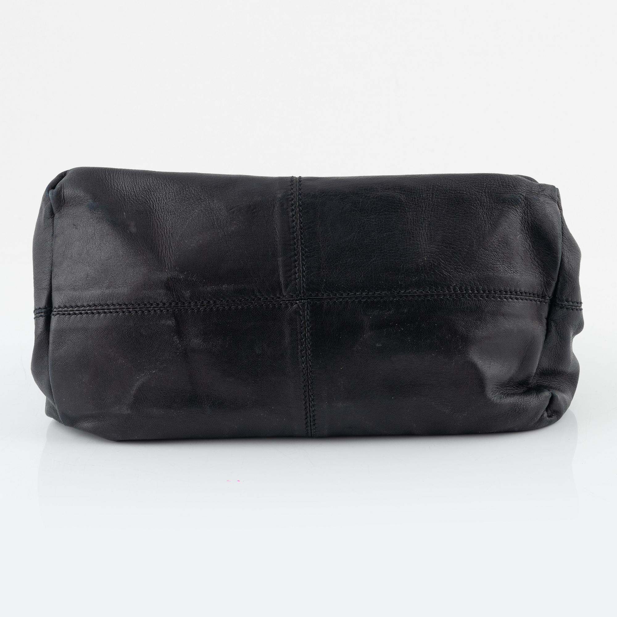 Prada, A black leather bag.