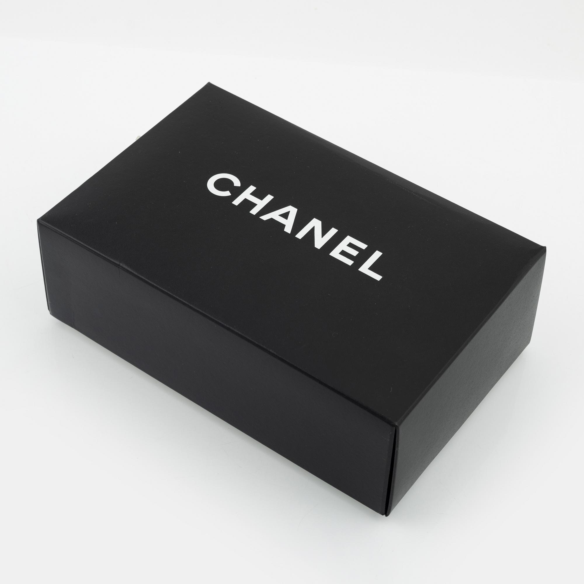 Chanel, A brown leather 'Mini Flap' bag, 1996-1997.