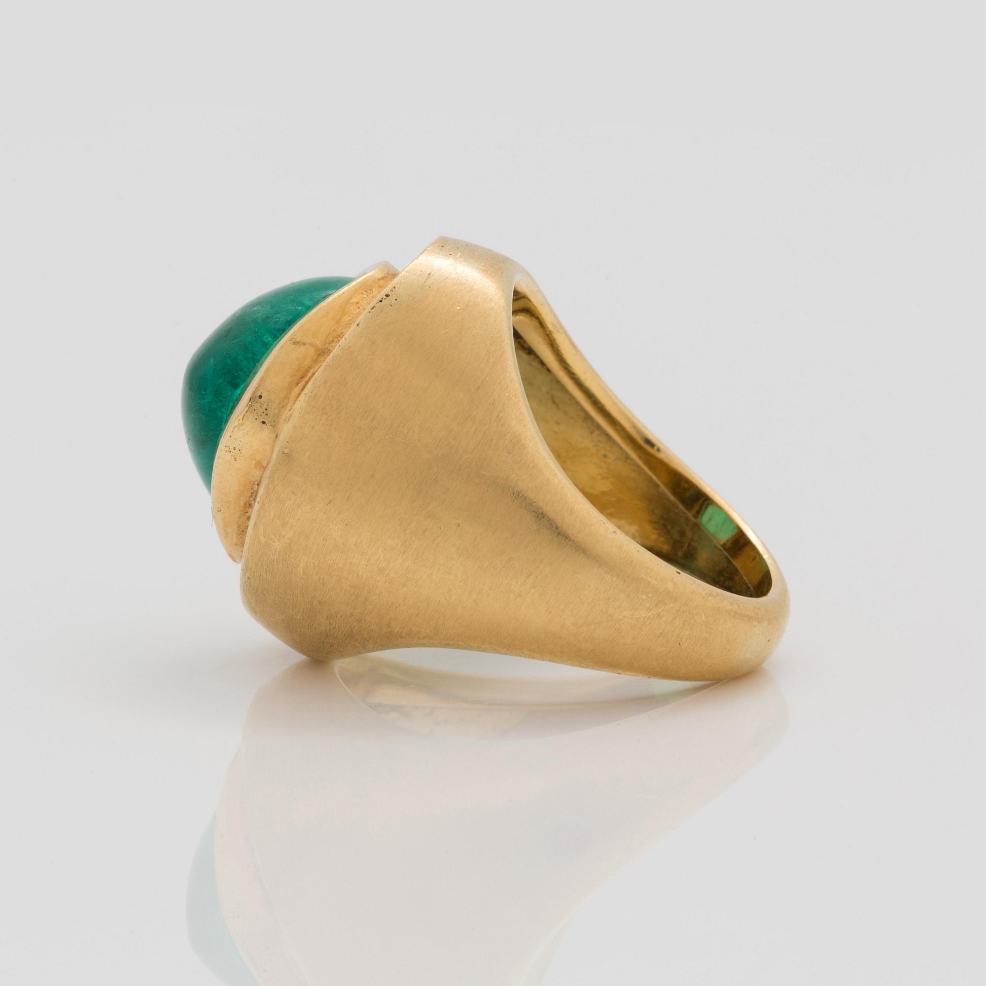 A circa 12.00 ct cabochon cut emerald and brilliant cut diamonds signed Cartier.
