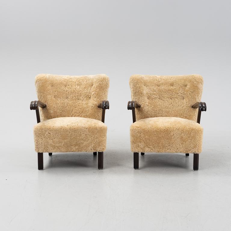 A pair of lounge chairs with new sheepskin upholstery, Denmark, 1930's/40's.