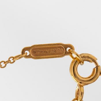 Tiffany & Co, an 18K gold 'Atlas Key' pendant with chain.