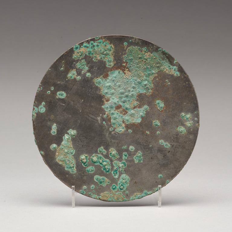 A bronze mirror, Han dynasty (206 B.C - 220 A.D).