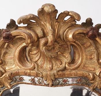 A Swedish giltwood and polychrome-painted Rococo mirror, later part of the 18th century.