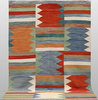 A Kelim carpet, c. 242 x 178 cm.
