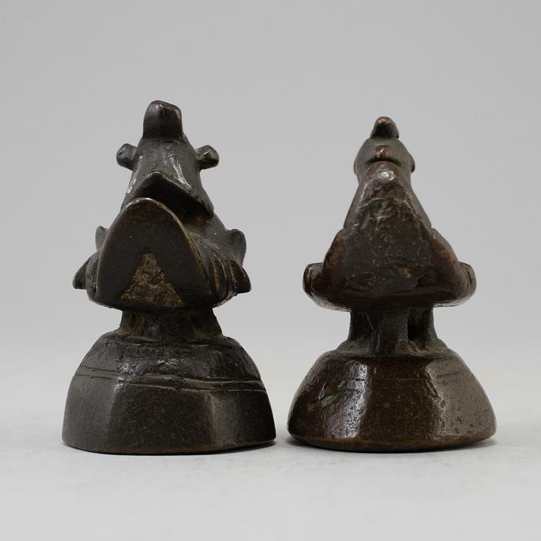 Two opium weights, Burma, circa 1900.