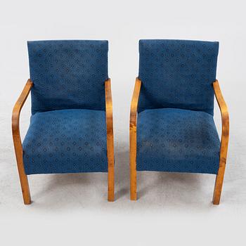 A a pair of stained birch armchairs 1930s-40s.