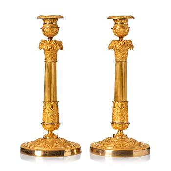 116. A pair of French Empire candlesticks, beginning of the 1800's.