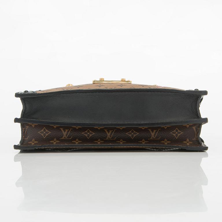 Louis Vuitton, a "Reverse Monogram Trunk Clutch" bag.