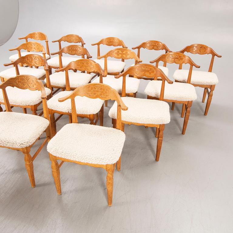 A set of 14 Henning Kjaerulf 1950s oak chairs.