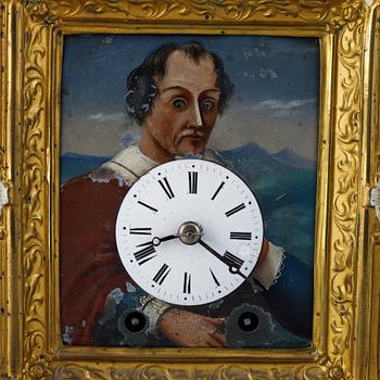 A Schwarzwald area wall pendulum clock with mechanical eye-movment, mid 19thcentury.