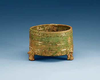 1249. A green glazed tripod censer, Han dynasty (206 BC – 220 AD).