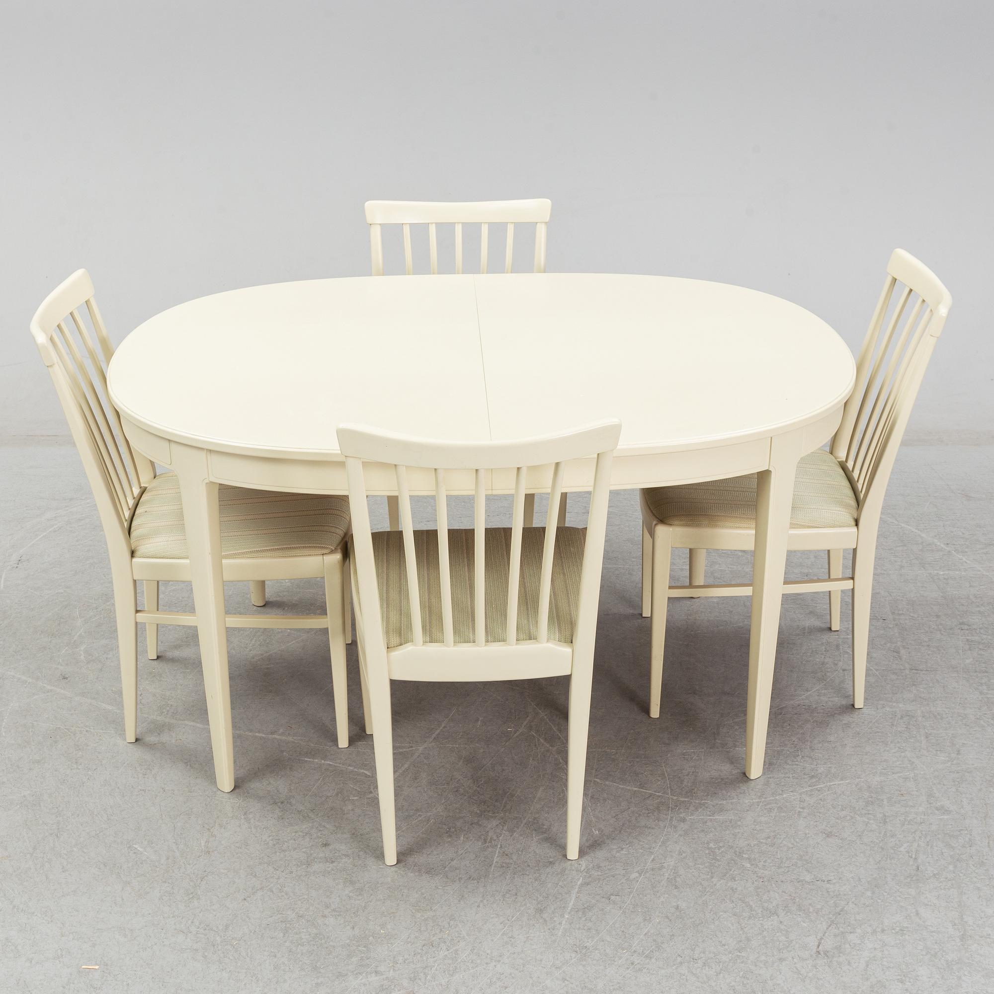 A dining table with six chairs by Carl Malmsten. Second half of the 20th Century.