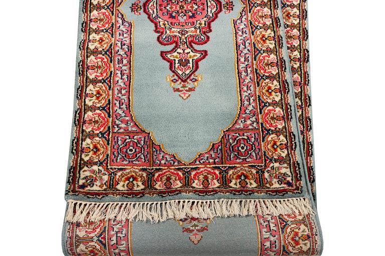 An oriental runner, c. 550 x 74 cm.