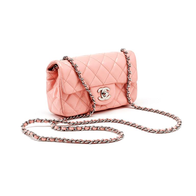 CHANEL, a mini pink quilted patent crossbody bag.