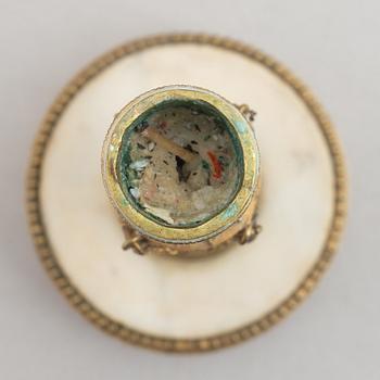 A late Gustavian gilt brass and marble candlestick, late 18th century.