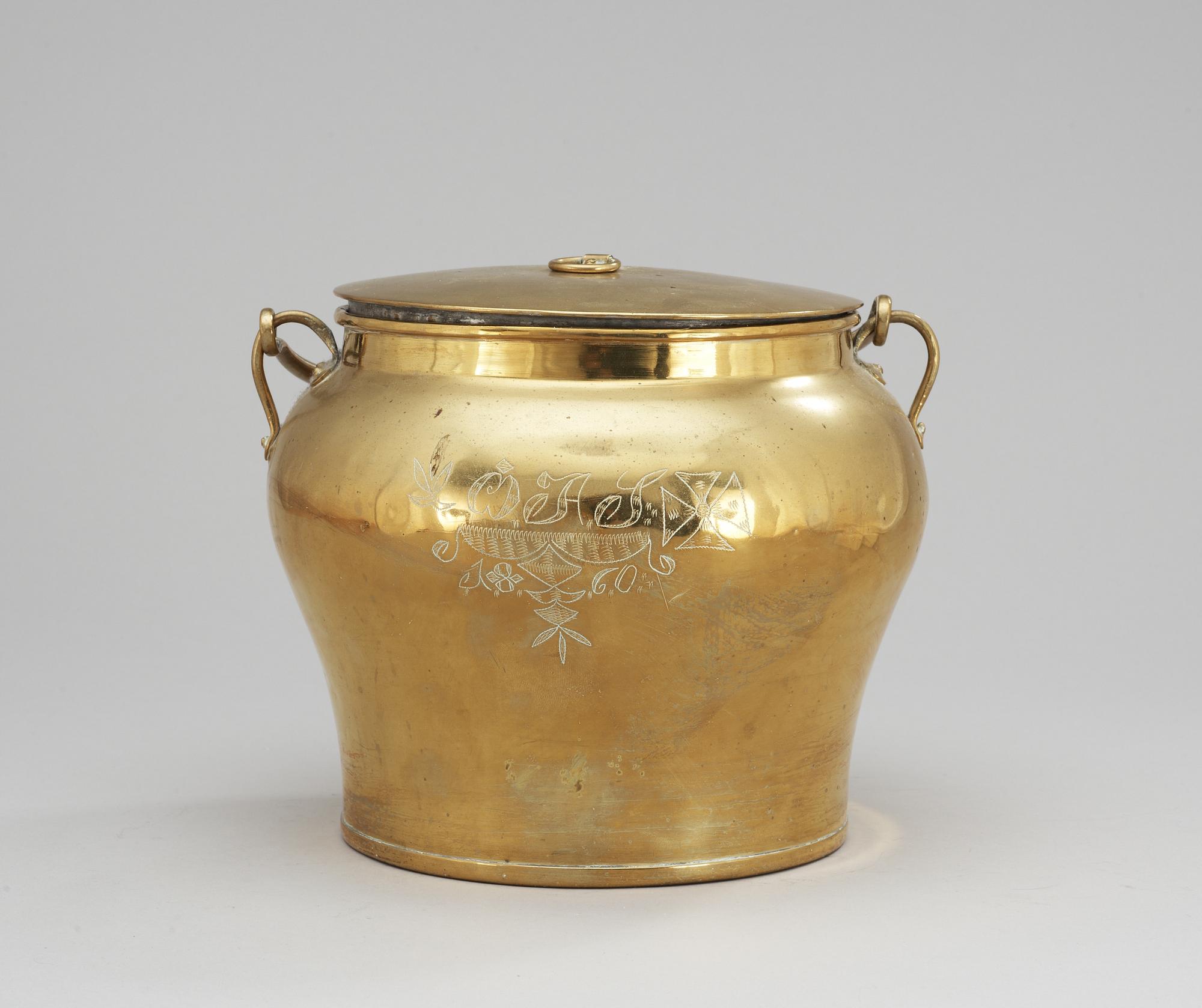 A Skultuna brass pot with cover, dated 1860.