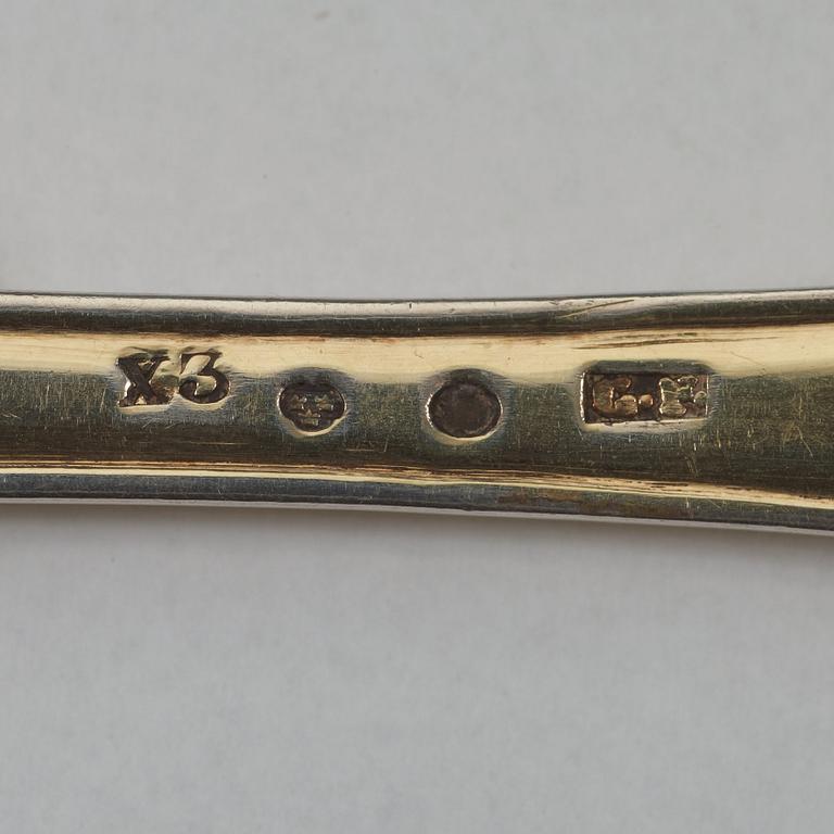 A pair of Swedish 19th century silver-gilt sugar-spoons, makers mark of Gustaf Folker, Stockholm 1824.